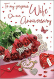 The image shows an anniversary card styled as a tender vignette, reminiscent of a romantic moment shared in a Harrow on the Hill café or tucked-away garden. In the centre, a cluster of red roses takes pride of place, the blooms full and luxuriant, with petals layered in sweeping spirals that create a sense of depth and softness. The rich scarlet colouring is softened by the natural daylight that washes over the scene, making the roses appear almost luminous against the paler background. Sprays of fresh greenery peek between the flowers, adding a hint of woodland charm and framing the arrangement like a miniature bouquet. Just beside the roses rests a pale envelope, its surface smooth and slightly reflective, poised as though it has just been placed down after being sealed with care. A glossy, heart-shaped keepsake box in vivid red sits close by, its curved outline and polished finish catching glints of light, suggesting the presence of something precious inside. A piece of delicate jewellery-perhaps a fine chain or pendant-lies gently draped nearby, introducing touches of metallic sparkle. Tiny heart shapes and scattered decorative accents trail across the card's surface, arranged in a way that feels both playful and intentional. A solitary butterfly motif adds a final, airy detail, as if drifting on a quiet anniversary breeze. In the background, flowing script text can be seen, lending a handwritten charm. Together, these elements create a scene that feels personal, heartfelt, and perfectly suited to honouring an enduring love story rooted in Harrow on the Hill.